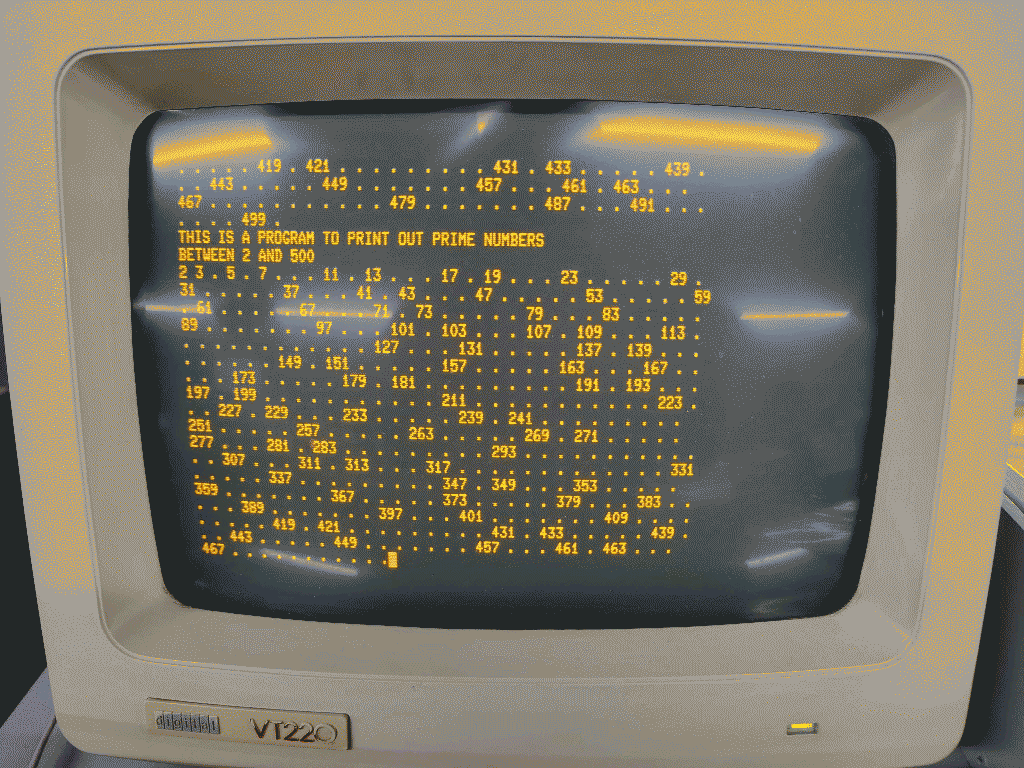 Amber CRT monitor printing prime numbers
